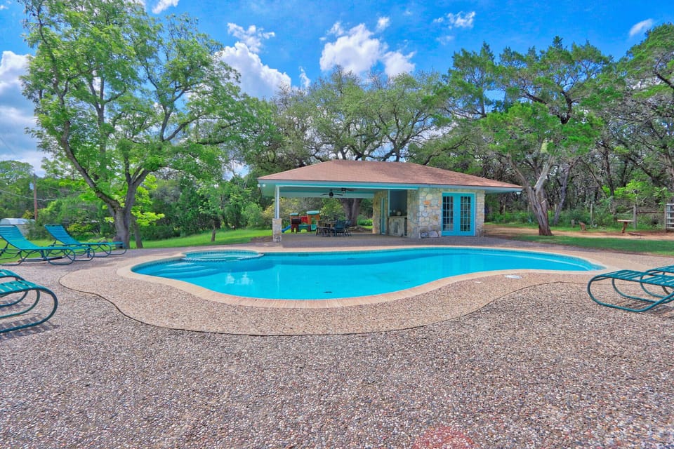 Secluded swimming pool with pool house