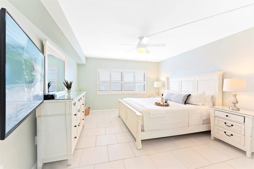 Serene master bedroom with king bed, walk in closet, makeup station, TV & ensuite