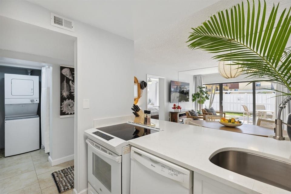 Kitchen with full appliances and ample counter space.