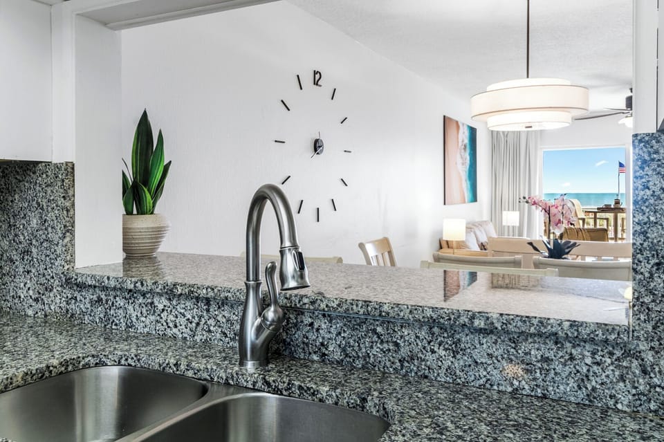 Kitchen sinks with ocean and pool views from the balcony!