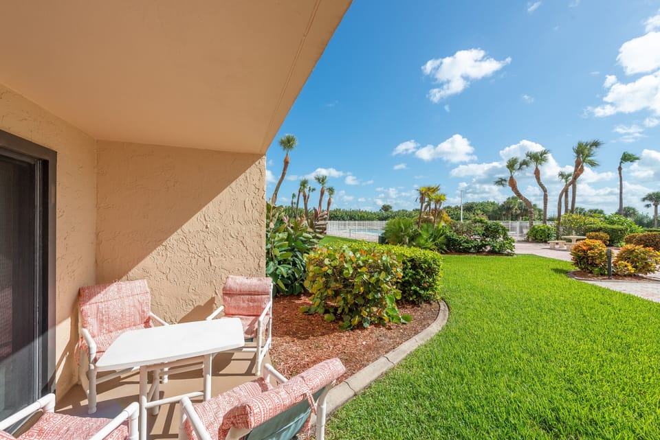 Scenic walk from your private patio to the pool, surrounded by lush greenery.