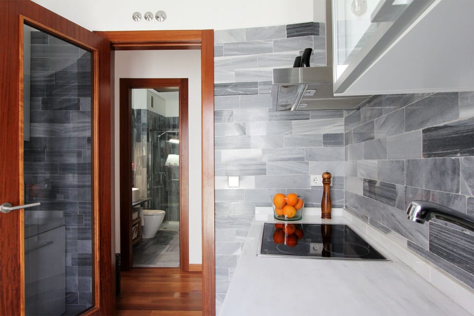 View towards the bathroom from the kitchen.