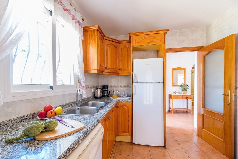 Beautiful villa with private pool located in Calpe (Costa Blanca), for 8 people with four bedrooms and two bathrooms distributed on a single floor (upper floor), since the lower one is closed and uninhabited.INTERIOR: Composed of living room with sat / tdt tv, and access to covered terrace and pool. Fully equipped independent kitchen with dishwasher and gas fires, a bedroom with two single beds, a separate bathroom with a bathtub, a bedroom with a double bed, a bedroom with two single beds, a separate bathroom with a bathtub and washing machine, and finally a bedroom With two single beds.EXTERIOR: It has a closed and partially wooded plot of 700 m² approx. You can enjoy the pool (8x4) of Roman stairs, outdoor shower, barbecue and space for sunbathing in the hammocks. Parking within the same plot for 3-4 vehicles.SITUATION: The villa is located in the urbanization Pla Senieta, quiet urbanization and a few meters from the center of Calpe (0.7 km), the sandy beach (beach and promenade arenal-bol 1.2 km), the shopping center and supermarket (0.7 km) and the tennis club and restaurant (0.4 km).OBSERVATIONS: Free WiFi. Pets are allowed up to 12 kg with supplement.