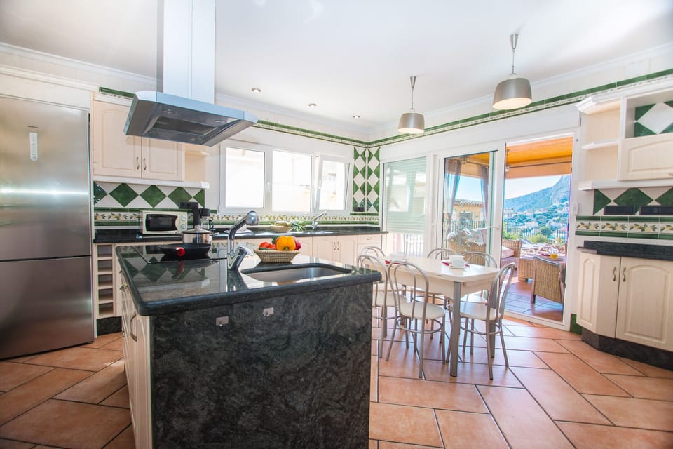 Beautiful villa with private pool located in Calpe (Costa Blanca) for 10 people with five bedrooms and two bathrooms.INTERIOR: The villa is divided into three floors separated by internal stairs. The MAIN FLOOR is distributed in two bedrooms; one with two single beds and the other with a double bed. It has a bathroom with shower, which is accessed through the two bedrooms. From a double bedroom on this floor, a bedroom with a double bed is accessed by stairs. The GROUND FLOOR consists of a spacious living room and a fully equipped kitchen. Two rooms with two single beds each and a bathroom with separate shower.EXTERIOR: Exceptional rectangular pool, fenced for the safety of children. Splendid covered barbecue and a chill-out area where you can relax.DISTANCES: A short 750 m walk will take you to one of the best sandy coves in Calpe. Restaurant also in Cala Puerto Blanco. The center of Calpe and supermarket is 1.2 km away.OBSERVATIONS: Free Wifi. Pets with a weight of less than 12 kg can be accommodated with a supplement.