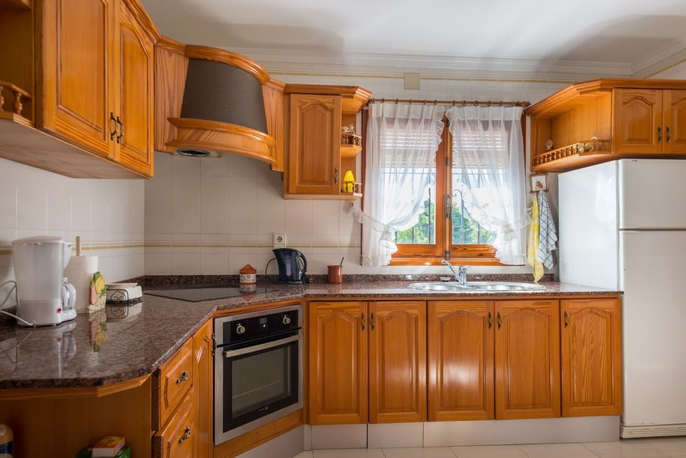 This beautiful holiday villa is located in Moraira, on the Costa Blanca, and can accommodate up to 8 people. With four bedrooms and two bathrooms spread over two floors, it offers all the space necessary for a comfortable and relaxing stay.Inside, the ground floor has a spacious living-dining room with satellite and terrestrial television, a fully equipped independent kitchen with ceramic hob and dishwasher, and access to a covered terrace and the pool. There are also two bedrooms with two single beds each, a bedroom with a double bed and a separate bathroom with a bathtub. On the upper floor, there is another bedroom with a double bed and an en-suite bathroom with a bathtub and access to a solarium.Outside, there is a large terrace with a private 7.5x3 meter pool, with Roman stairs and an outdoor shower. In addition, there is a built-in barbecue to enjoy meals outdoors. Parking for two vehicles is located on the same plot, which is completely closed.The location of this villa is ideal for those who want to do without the vehicle during the holidays. It is located just 750 meters from the sandy beach and all the restaurants in the area. The nearest supermarket is 1 km away and the center of Moraira is just 780 meters away.Some additional notes are that free WiFi is provided in the villa and that pets up to 12 kg are allowed with an additional fee.