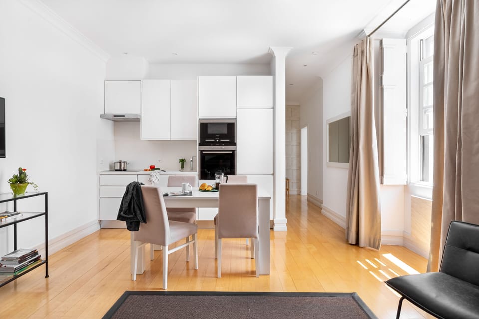A peaceful and bright lounge with open kitchen
