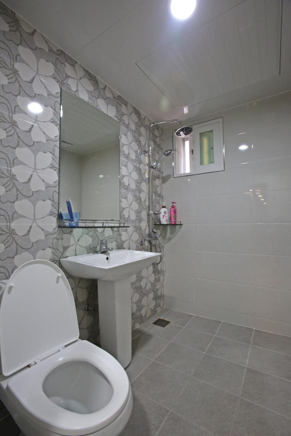 Shower, hair dryer, slippers, towels