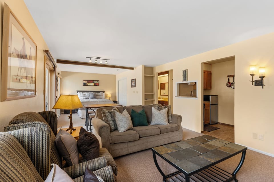 Step into your bright, welcoming retreat where the living room flows into a cozy bedroom and kitchenette—thoughtfully designed for comfort and relaxation.