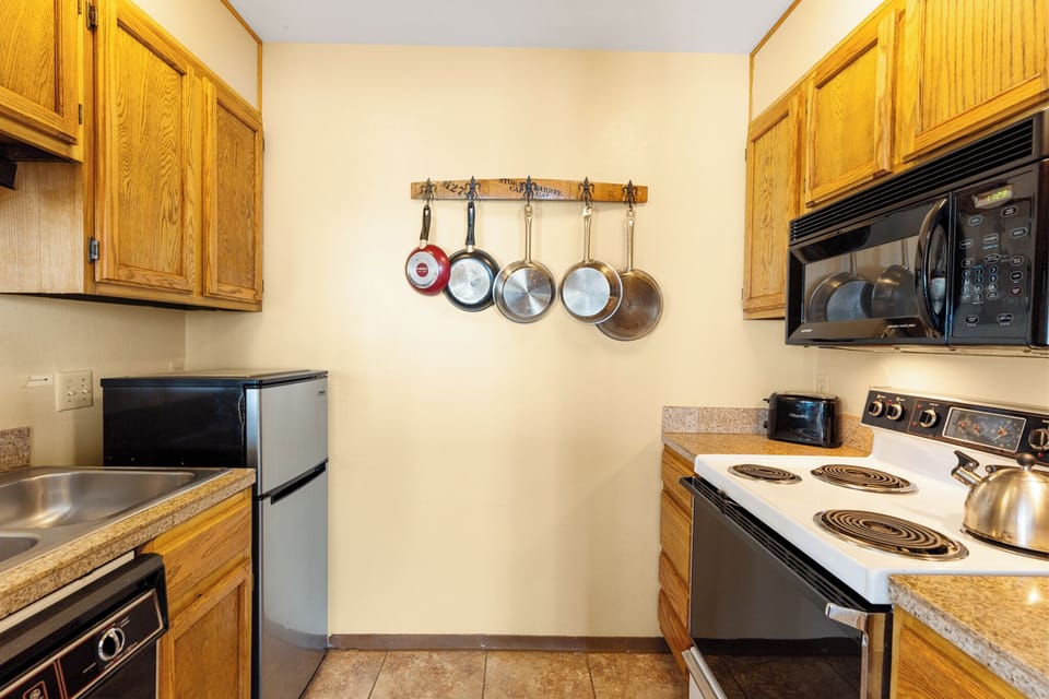 Your well-equipped kitchen comes with full-size appliances and everything you need to whip up a home-cooked meal during your stay.