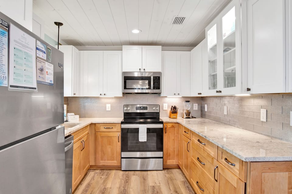 Full equipped kitchen with stone counters and stainless appliances