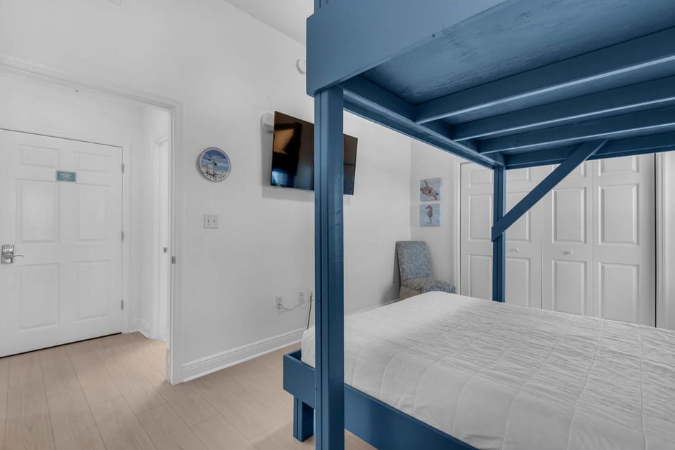 Bunk room with flat screen TV