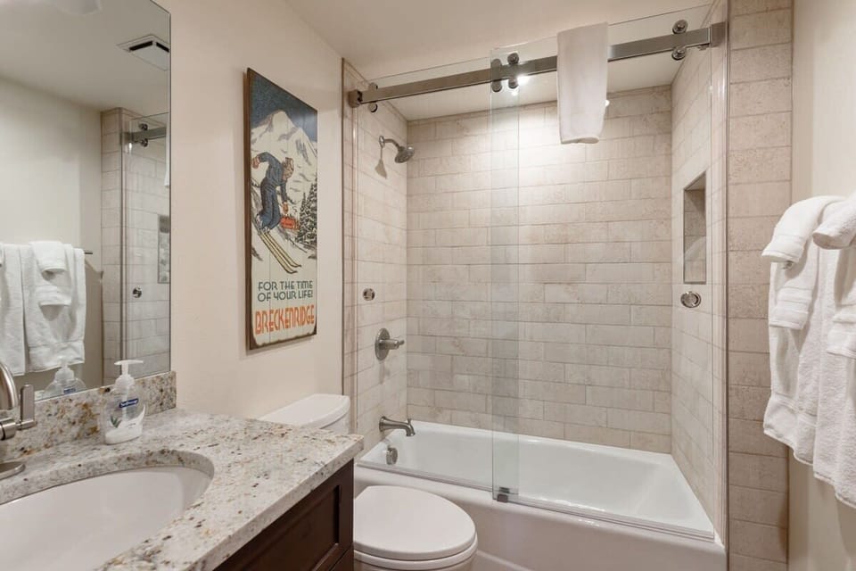 Full bathroom with shower and tub