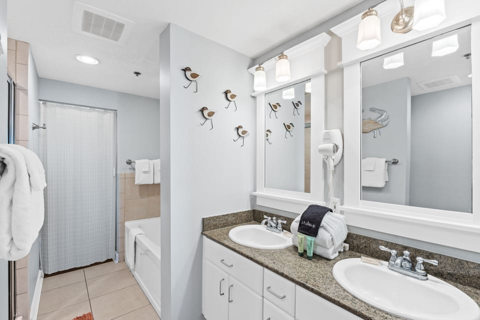 Primary Bathroom with Garden Tub and Stand Up Shower with double vanity sink