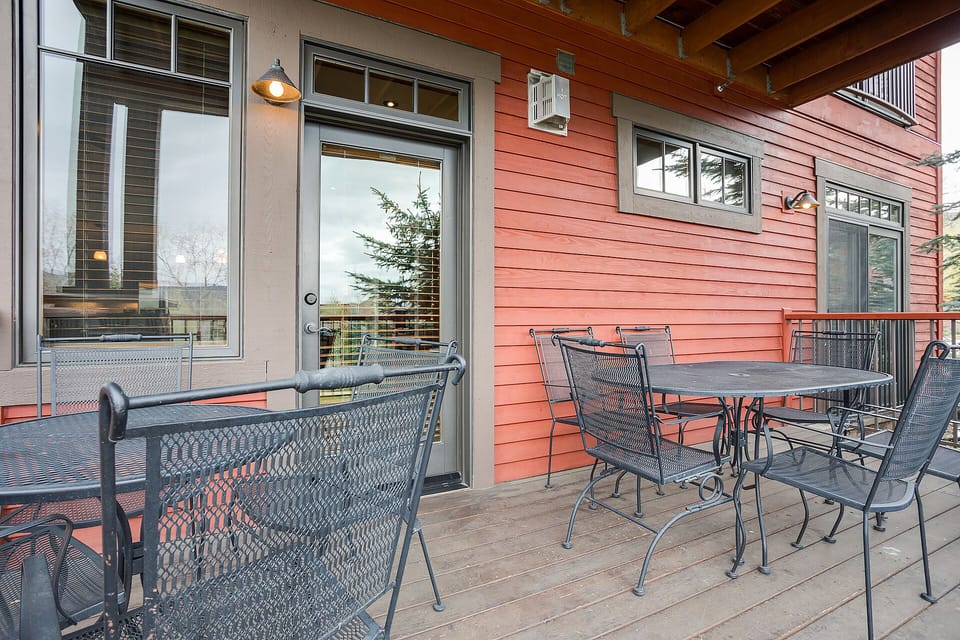 Step onto your private covered deck where morning coffee and evening conversations flow naturally around the stylish outdoor dining set.