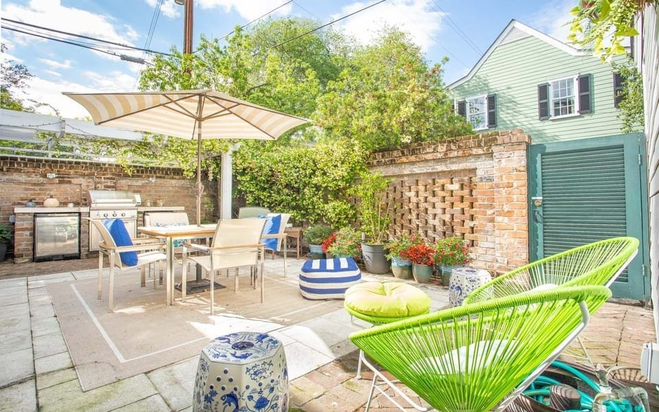 The private back courtyard with built-in grill and refrigerators.