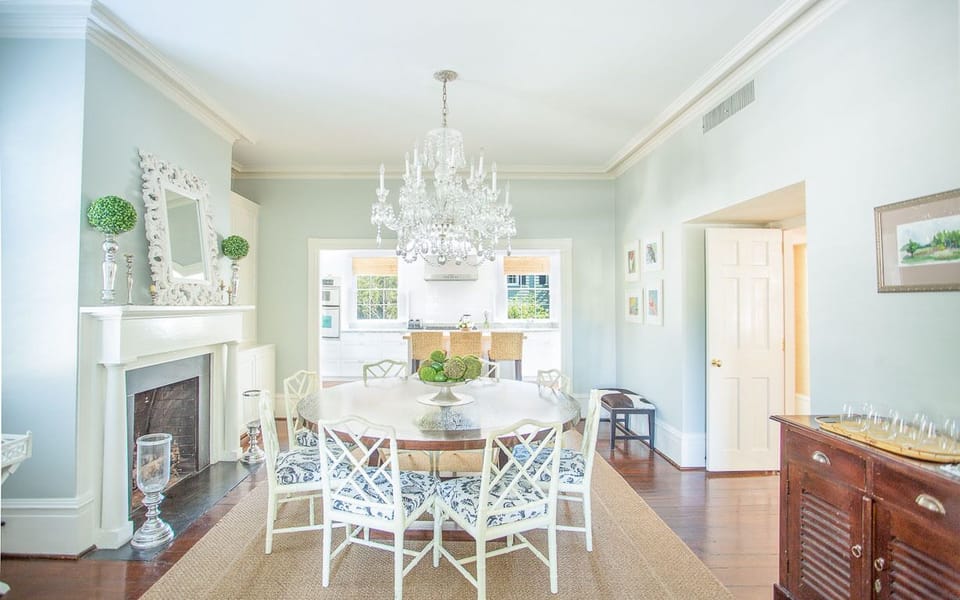 The dining room, with its large, round table is also bright and spacious.