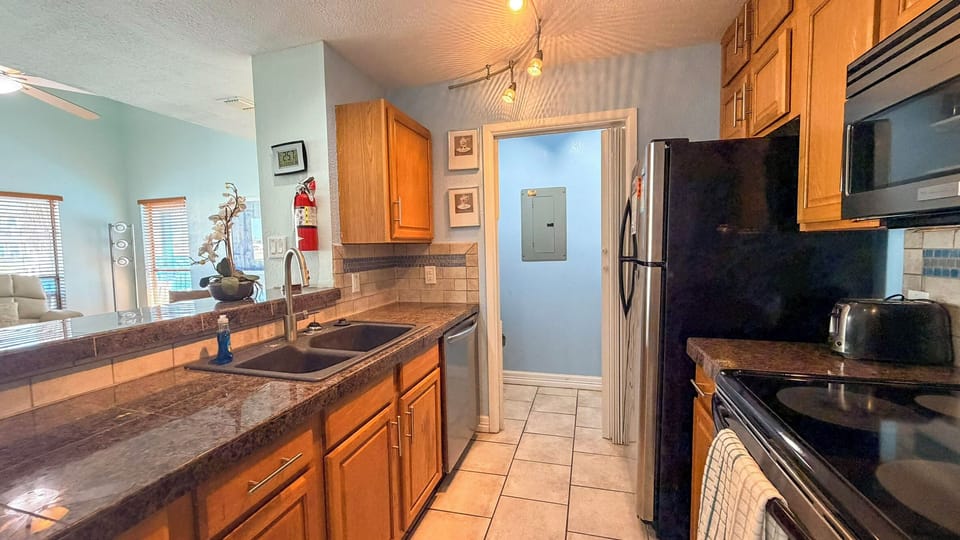 Your fully equipped kitchen awaits with granite counters, stainless appliances, and everything you need to create memorable meals during your stay.
