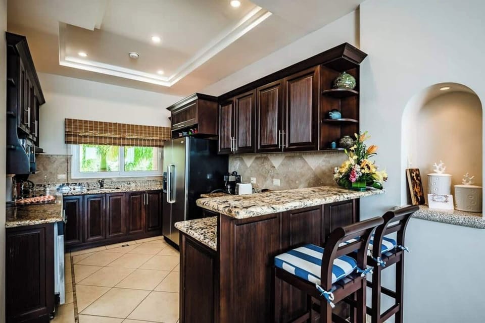 Kitchen is near the living area with a kitchen counter