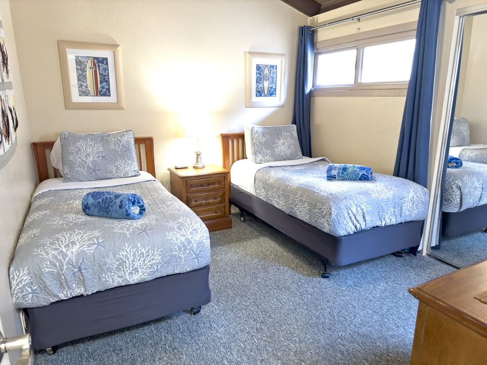 Main level bedroom has twin beds that can be converted into a King on request.