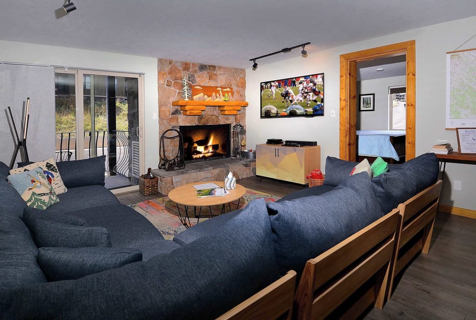 Living room, wood fireplace, deck