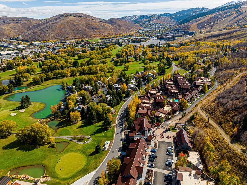 Golf course and resort community aerial in autumn.