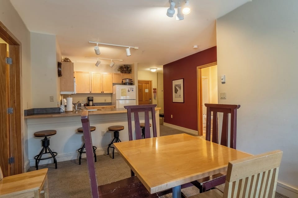 You'll love this open kitchen and dining space where shared meals become lasting memories. Modern appliances meet warm wood accents.