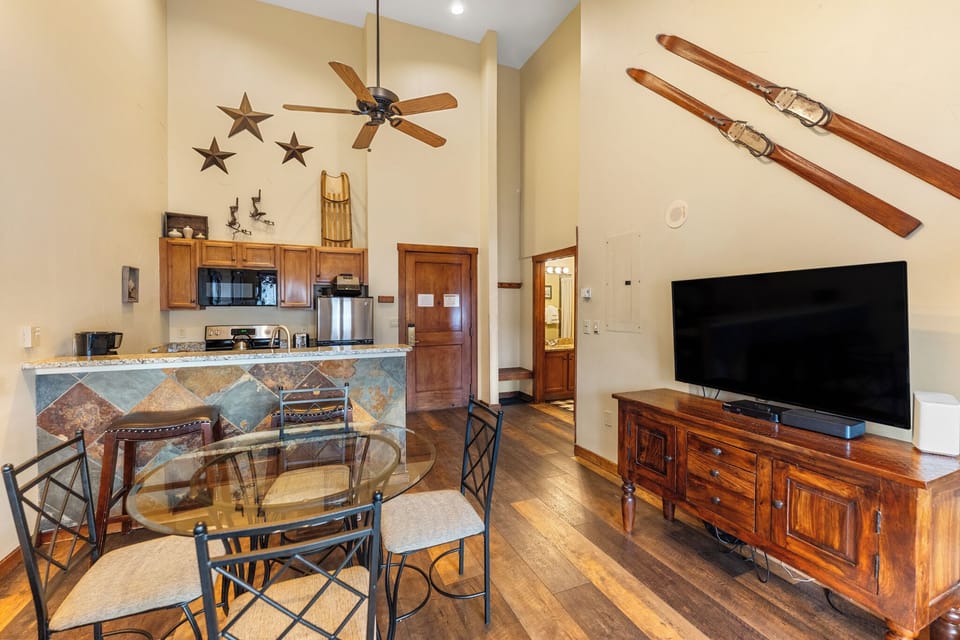 Unwind in your cozy mountain retreat with soaring ceilings, rustic ski decor, and a fully equipped kitchen perfect for après-ski meals.