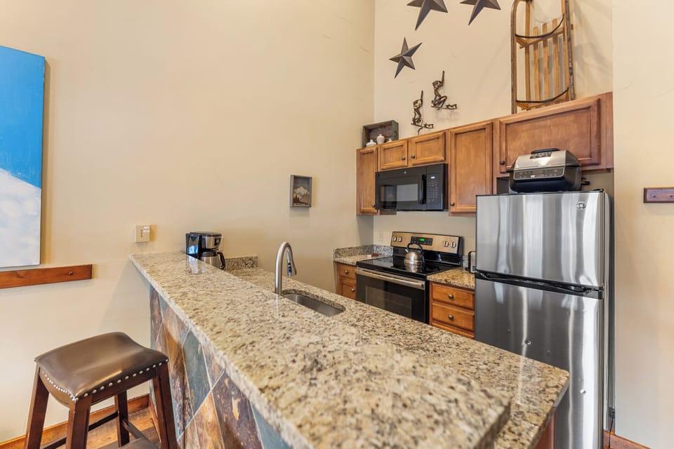 Your fully equipped kitchen features granite countertops, stainless steel appliances, and everything you need to cook memorable meals during your stay.