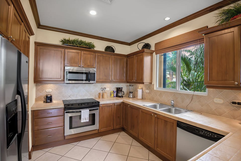 The kitchen is fully equipped with modern appliances, ample counter space, and all the essential cookware and utensils you need.