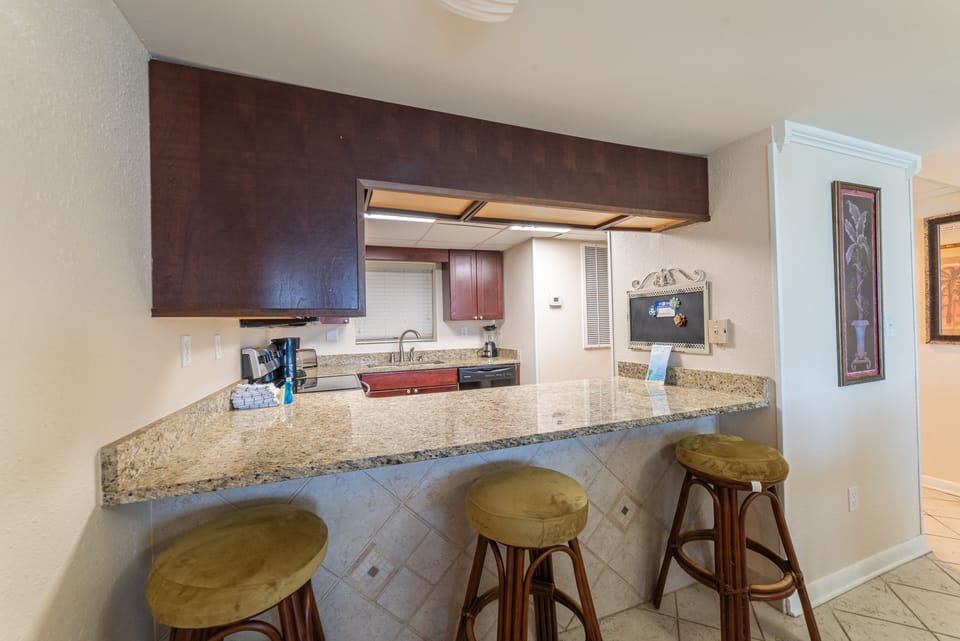 Another view of the breakfast bar and kitchen.