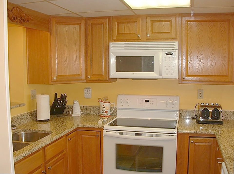 Well equipped kitchen has beautiful appliances, granite counter tops and beautiful cabinets with lots of storage. Has a Keurig and a drip coffee maker.