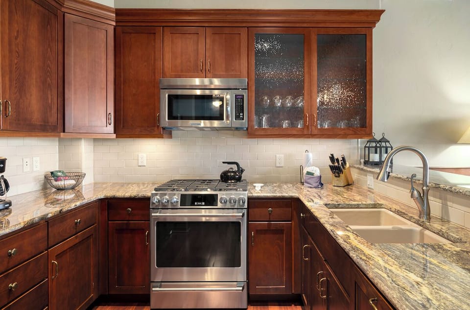The kitchen is also equipped with stainless steel appliances.