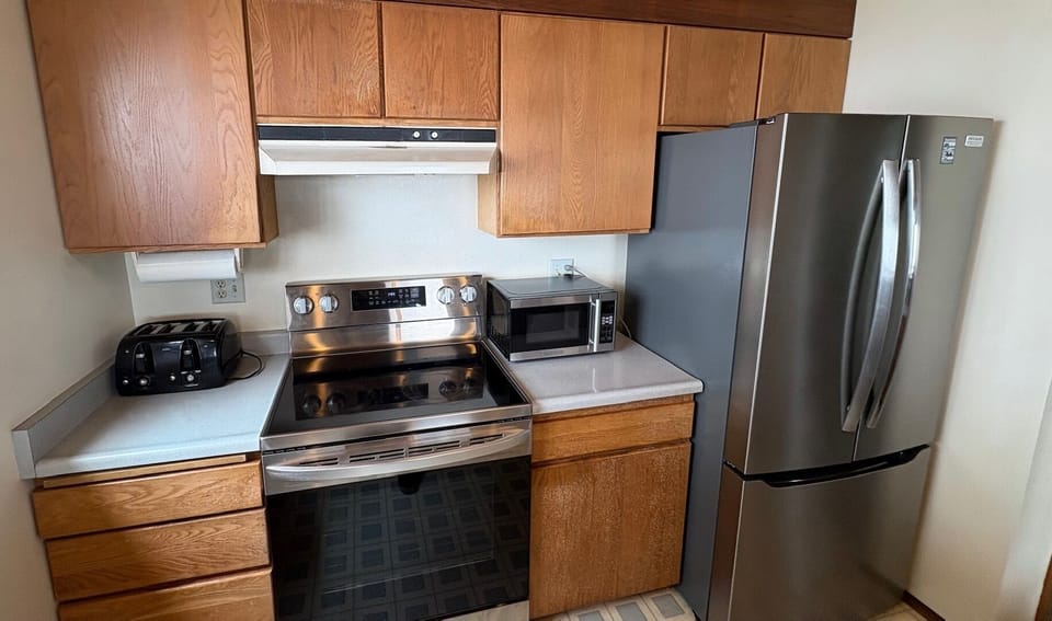 The kitchen is small but complete.  It has an electric stove and oven, microwave, coffee pot, toaster and a dishwasher.
