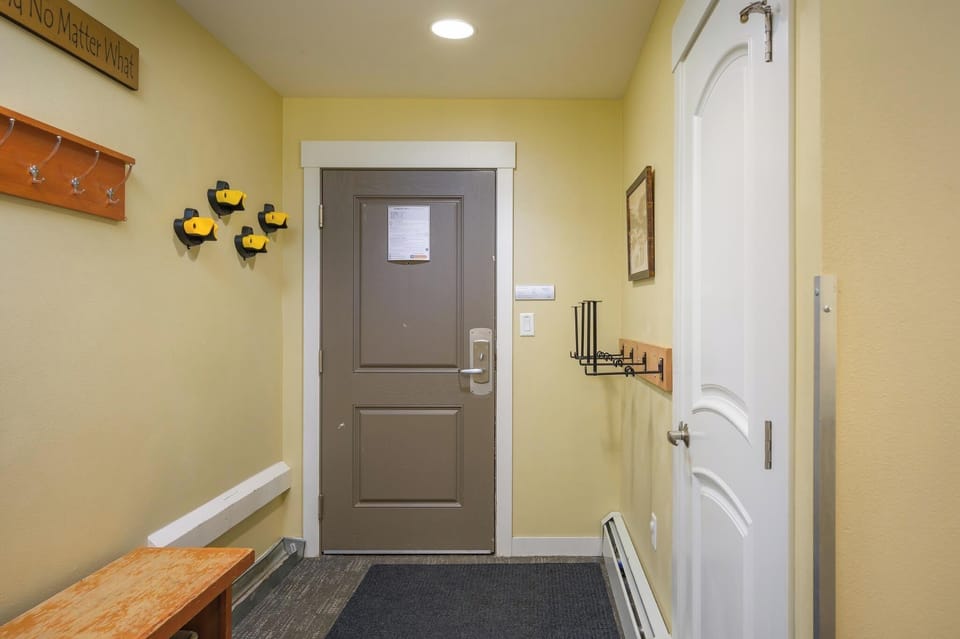 Spacious entryway with plenty of hanging space for jackets and gear