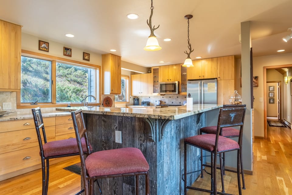 Your spacious kitchen features rustic charm with modern amenities, perfect for preparing memorable meals together.