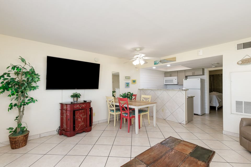 Relax in your bright, open living space with dining area and well-equipped kitchen - perfect for memorable vacation meals together.