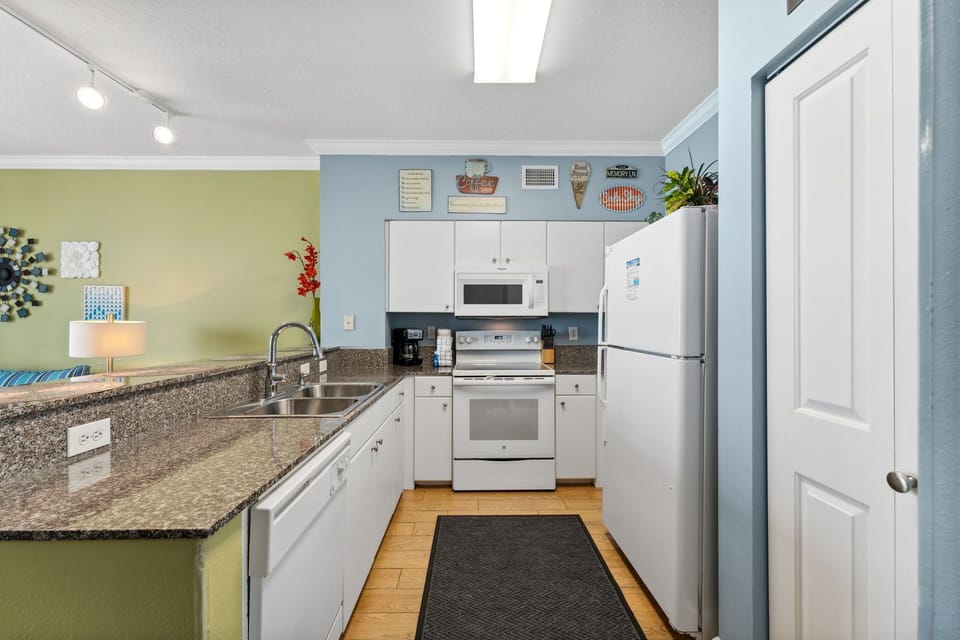 Fully stocked kitchen with bar seating