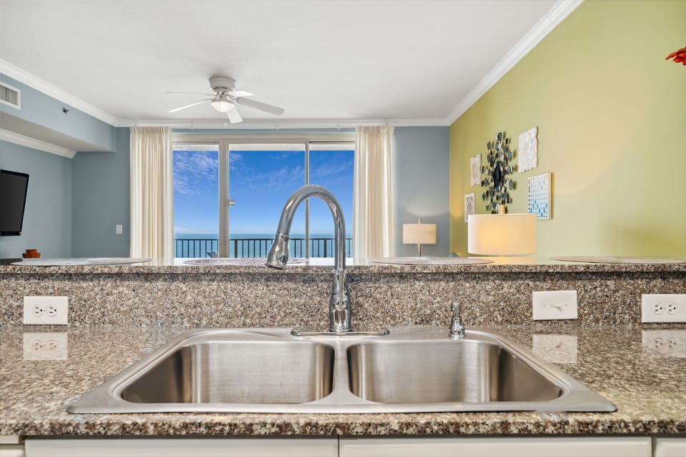 Fully stocked kitchen with bar seating