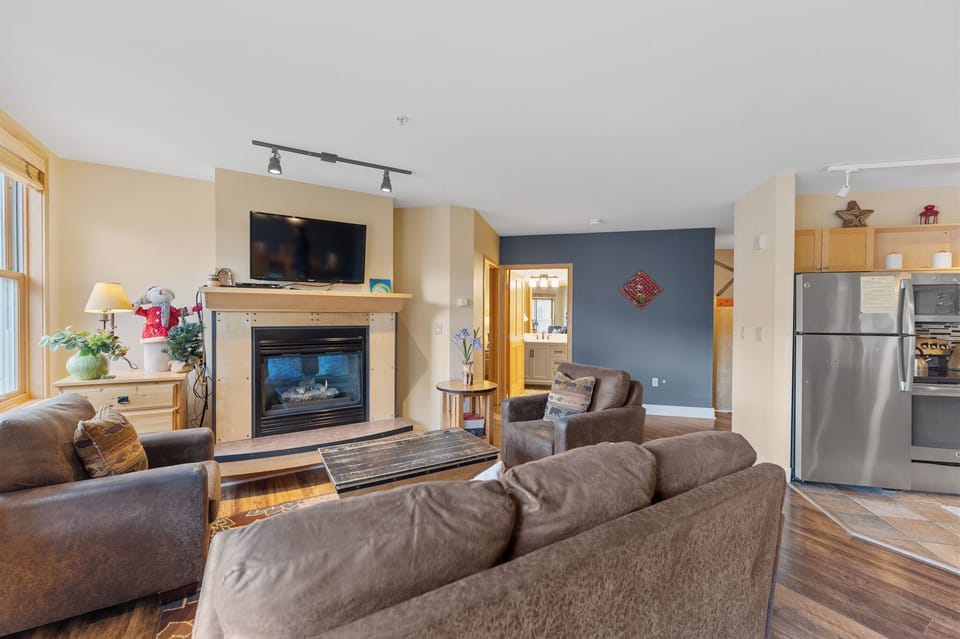 Sink into plush leather seating by your crackling fireplace, while modern amenities and warm colors create the perfect retreat for your stay.