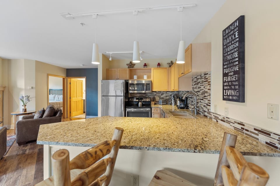 Your spacious kitchen features granite countertops, stainless steel appliances, and an open layout that flows into the living area for memorable meals.