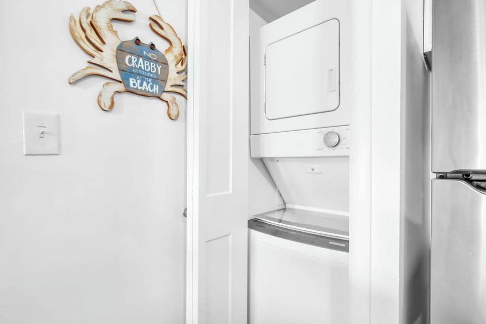 Stackable Washer and Dryer Are Conveniently Situated in The Kitchen Area