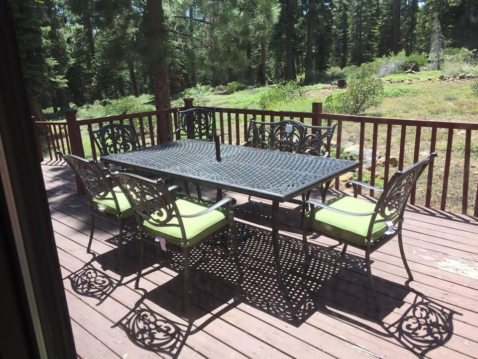 patio set with matching umbrella to enjoy outdoor living and the meadow view