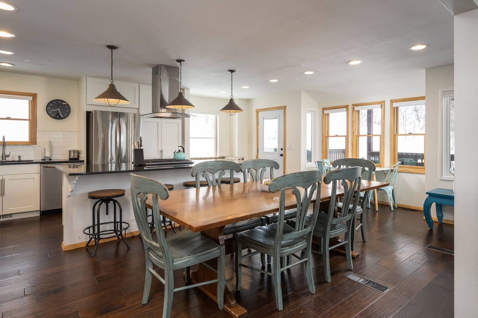 Open concept dining area (two tables + bar, seating for 13)