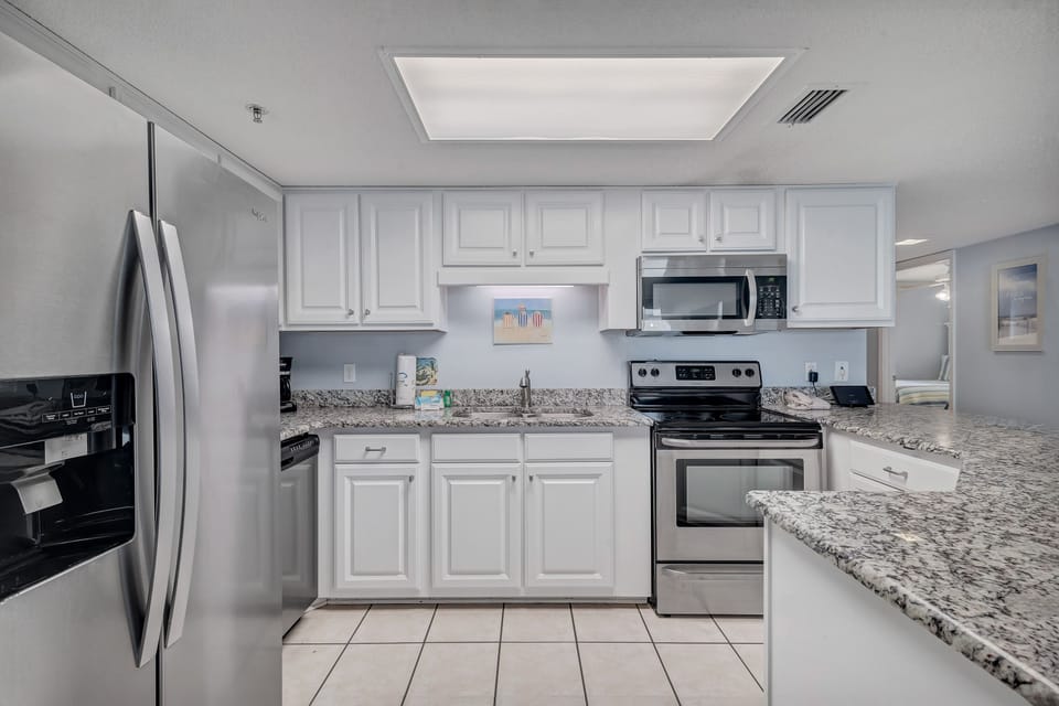 Updated Kitchen with Stainless Steel Appliances and Granite Counter Tops