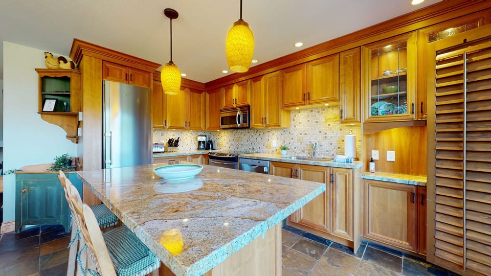 This bright, open kitchen features heated floors and everything you need to dine in.