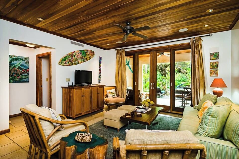 Relax in the cozy living space of this Tamarindo-area vacation rental. Watch your favorite shows on the flat-screen TV with cable while enjoying the inviting ambiance of this family-friendly Costa Rica villa.
