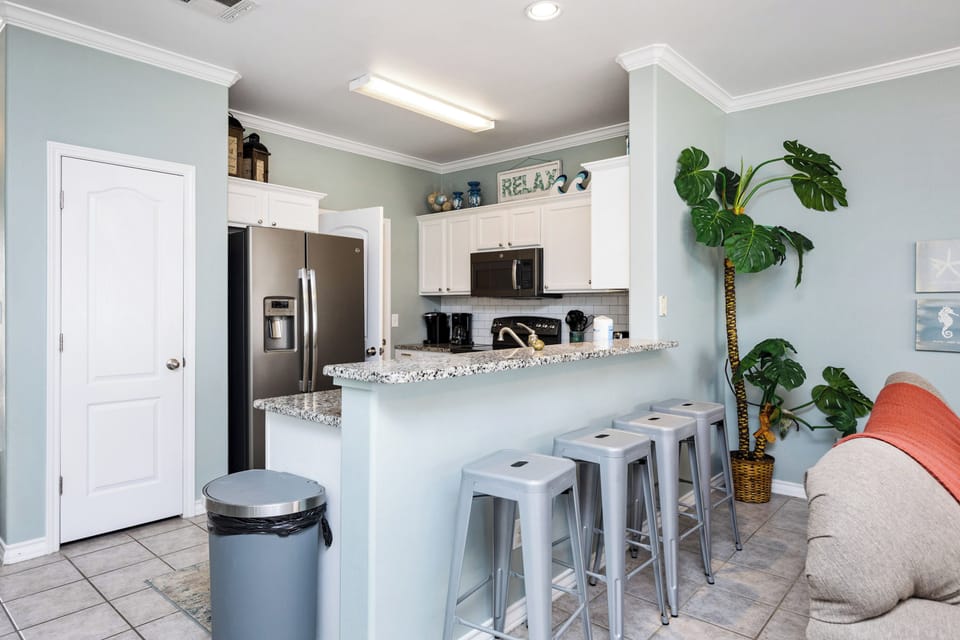 Relax in your open kitchen with granite counters, stainless appliances, and breakfast bar seating—perfect for morning coffee or casual meals.
