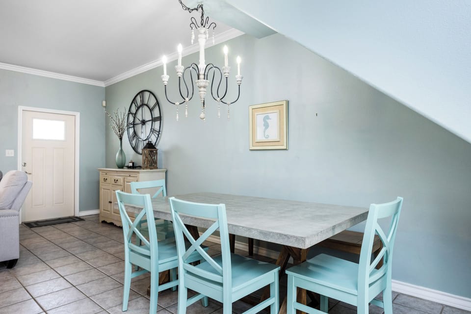 Gather around this elegant dining table for memorable meals together in your charming retreat.