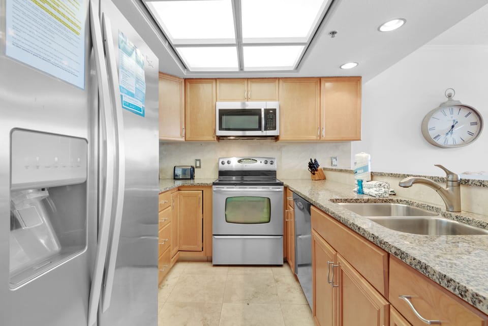 Kitchen has Granite Counter Tops