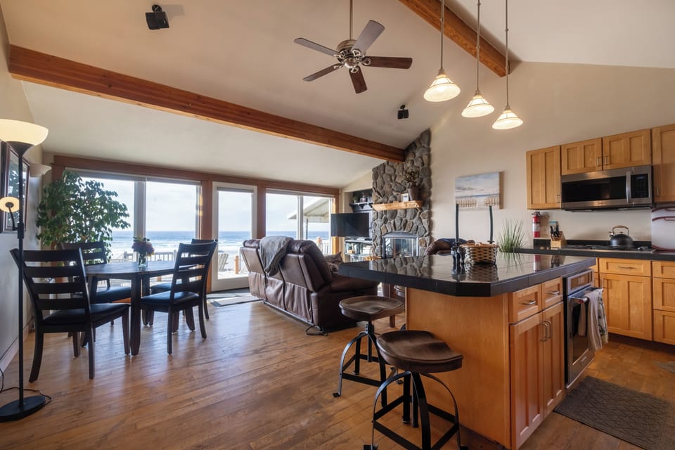Living room and kitchen island - Oceanfront views from everywhere